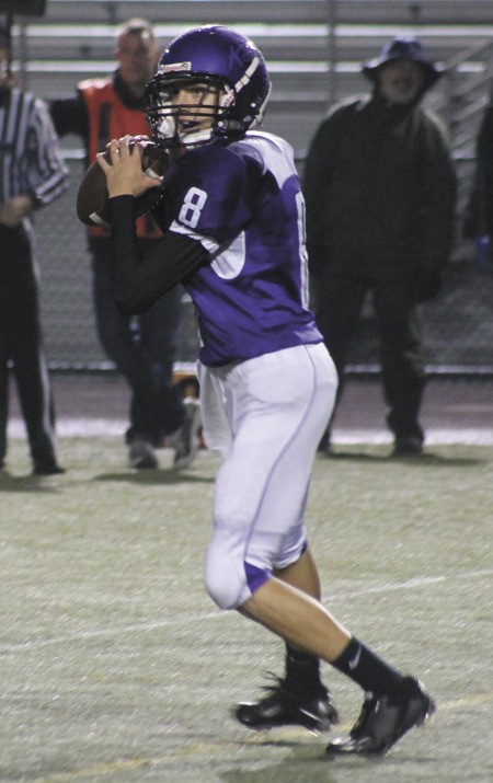 Lake Washington quarterback Nick Young looks to throw the ball during the Kangs home loss to Mercer Island last Friday. The team will play Lakeside this Thursday