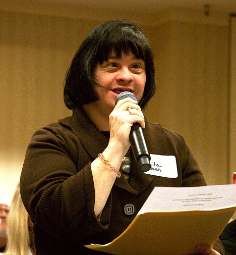 Kirkland resident Liala Dibeh speaks at a forum in front of more than 600 people in Tukwila Nov. 23. The forum gave the community a chance to let legislators know what people with disabilities need.