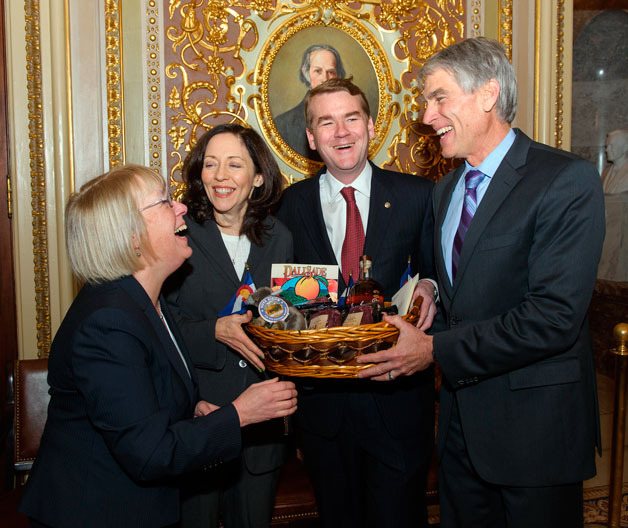 U.S. Senators Mark Udall (D-CO) and Michael Bennet (D-CO) made good on a friendly wager with U.S. Senators Patty Murray (D-WA) and Maria Cantwell (D-WA) after the Seattle Seahawks trounced the Denver Broncos 43-8 in Super Bowl XLVIII on Feb. 2.