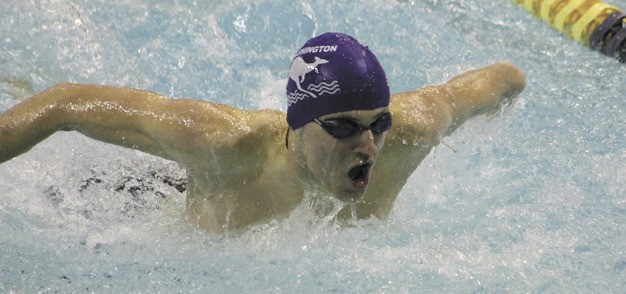 Lake Washington's Peter Dolan swims the 100 butterfly race during the KingCo championships at UW on Saturday