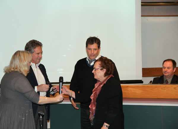 Holocaust survivor Susie Sherman and Rod Asher from the Washington State Holocaust Resource Center accept a proclamation from Mayor Joan McBride and Councilman Bob Sternoff during an April 3 council meeting.