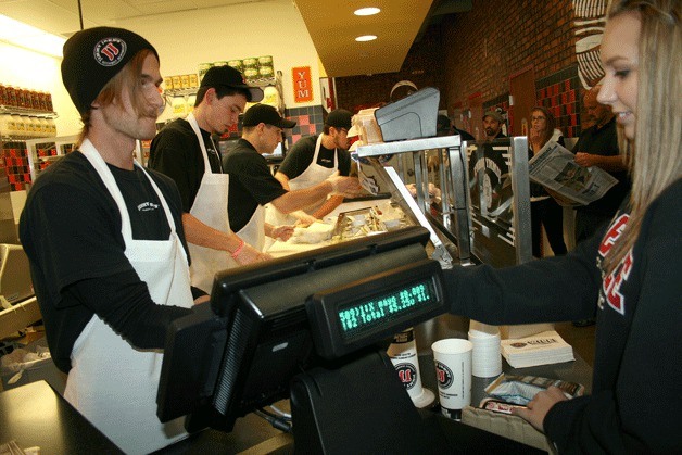 Mike Wilson rings up a customer during Jimmy John's Customer Appreciation Day on Thursday