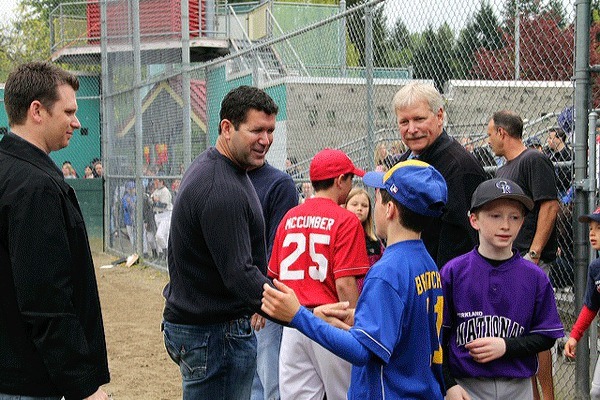 Seattle Mariner great and Kirkland resident Edgar Martinez visits with Kirkland National Little Leaguers during a FanFest event at Big Finn Hill Park's baseball fields on Saturday. Martinez threw out the first pitch