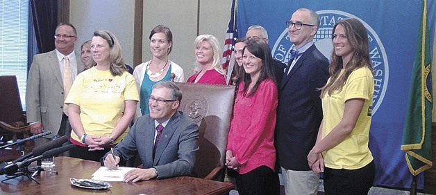 Gov. Jay Inslee recently signed SHB 1556 into law requiring all Washington state high school students to receive CPR training before they graduate. From left: Vance Lobe