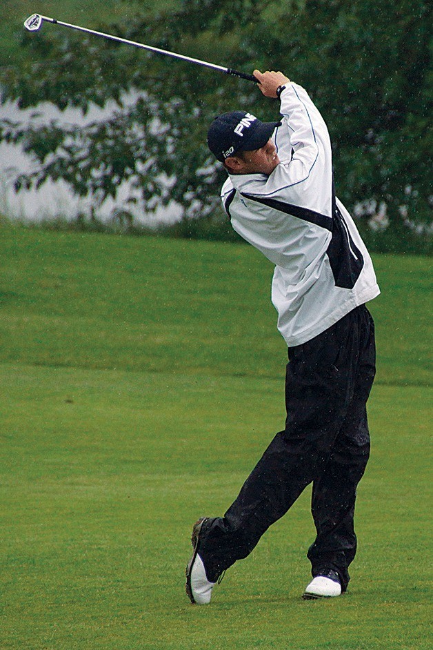 Juanita High School junior Frank Garber hits an approach shot to the 18th green in the first round during the WIAA Class 3A Boys Golf State Championship on May 21.