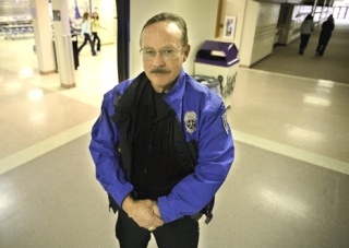 School Resource Officer Chuck Pierce stands in a hallway at Lake Washington High School Oct. 24.