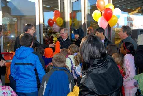 Kirkland Mayor James Lauinger and King County Library System Director Bill Ptacek cut the ribbon during the reopening of the Kirkland Library.