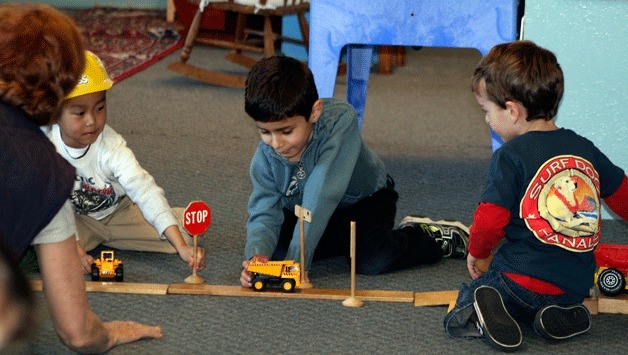 Some 4- and 5-year-olds play with construction vehicles at the non-profit Kirkland Preschool on Tuesday. The kids learned about construction during the week.