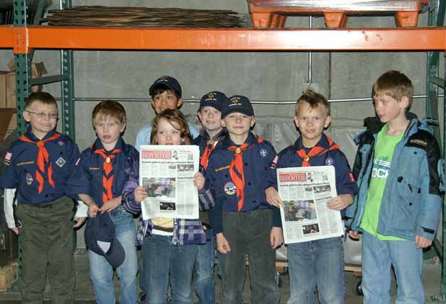 Kirkland Cub Scout pack 595 recently visited the Kirkland Reporter offices to learn more about the newspaper industry.