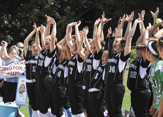 The Southwest team does the wave during the opening ceremonies of the Junior Softball World Series on Sunday afternoon in Kirkland.