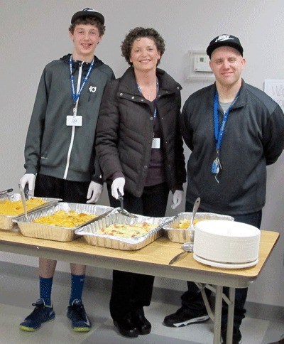 Ten members of Holy Family St. Vincent de Paul in Kirkland served homemade enchiladas