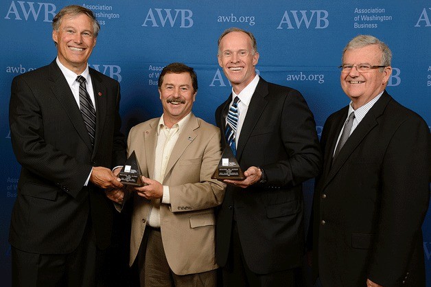 Gov. Jay Inslee presents Sen. Rodney Tom and Sen. Mark Schoesler with the 2013 Jim Matson Award. Pictured at right is AWB Board Chair Doug Bayne.