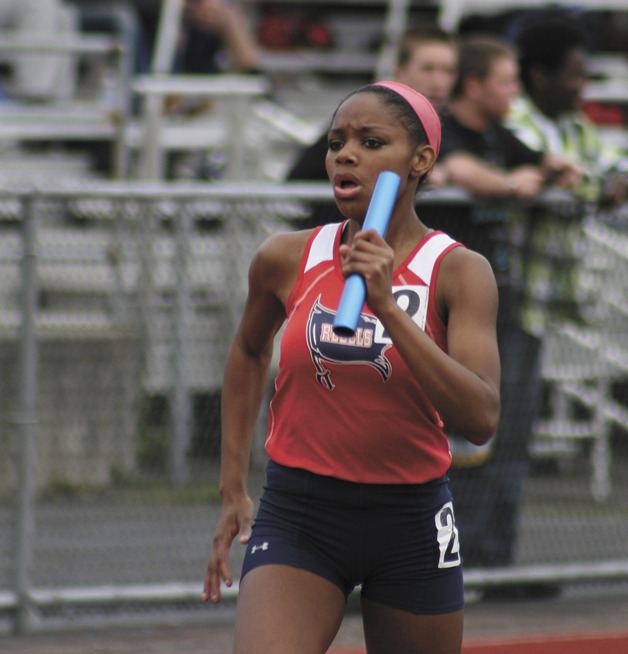 Juanita's Mikayla Jones sprints toward the finish line of the girls 4x200 meter relay race in the KingCo finals last Friday. She anchored the winning Juanita team