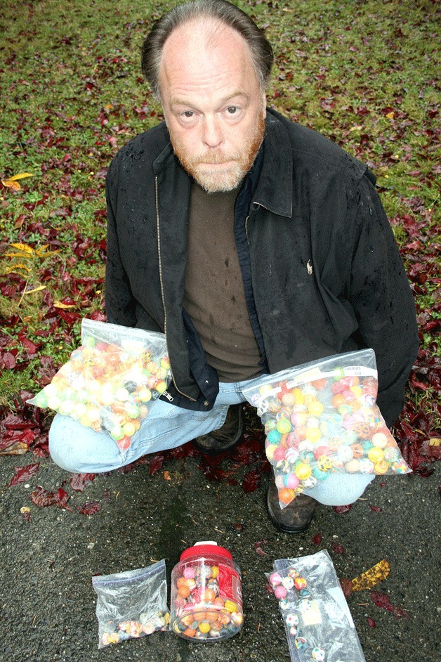 David Lamb has collected around 60 bouncy balls that he has found littering his Kingsgate neighborhood. He discovered that an employee at a nearby car wash has also collected hundreds of the balls