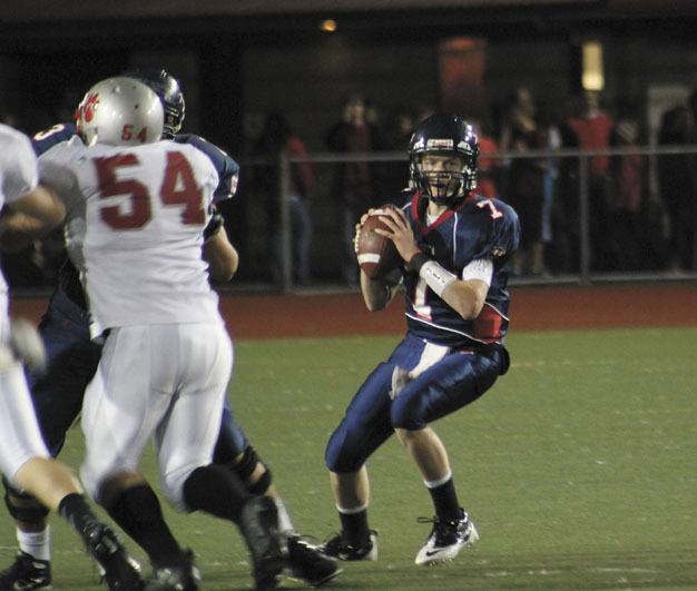 Juanita quarterback Riley Hilliker (7) looks for an open pass during the team's loss to Mount Si last week.