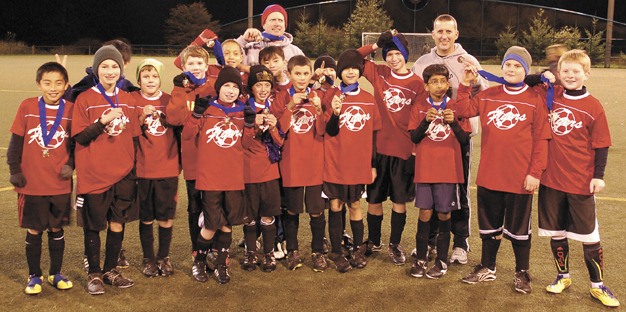 The Juanita Flyers won the U12 division of the Lake Washington Youth Soccer Association's year end tournament in November. The team consists of players from Frost