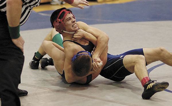 Derek Kao wrestles during the KingCo tournament last weekend at Liberty High School.