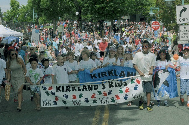 Kirkland youth march during the 2014 kids parade in downtown Kirkland. The kids events at Marina Park will kick off the annual Fourth of July festivities this year at 10 a.m. on Saturday for Independence Day.