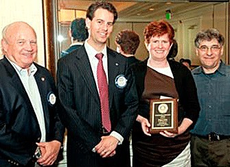 Pictured with Meg Lewis in the photo (from left to right) are Kirkland Rotary officers Jim Going and Brandon Hancoop