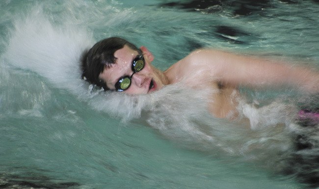 Lake Washington's Caleb Nakroshis in the Kangs first lap of the boys 200-yard medley relay last Tuesday afternoon against Mercer Island.