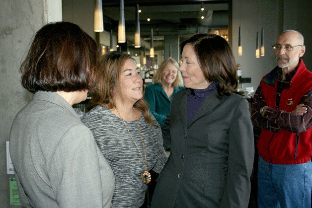 Incumbent Sen. Maria Cantwell (D-WA) (right) and 1st Congressional District candidate Suzan DelBene (left) chat with Volterra owner Michelle Quisenberry during a campaign tour of several Kirkland businesses on Monday morning.