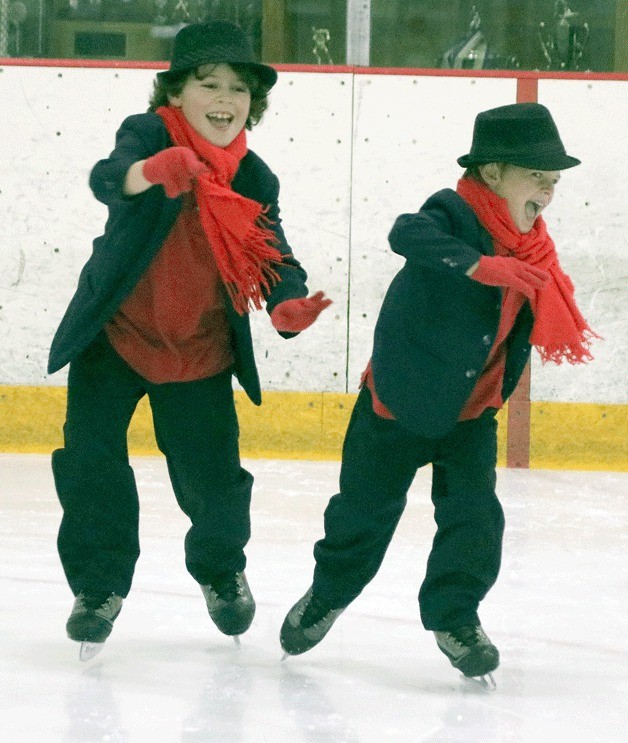 Local residents Devin Graupmann and Logan Graupmann perform in Winter Solstice at the Kingsgate Ice Arena on Dec. 11.