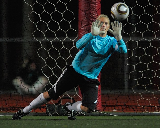 Rebel goal keeper Niki Fausset blocks Bellevue's final penalty kick attempt during an overtime shootout at Juanita on Wednesday.