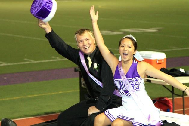 Reigning homecoming king and queen Max Bunnell and Jasmin Du wave to the crowd during the Kangs home football game on Sept. 30.