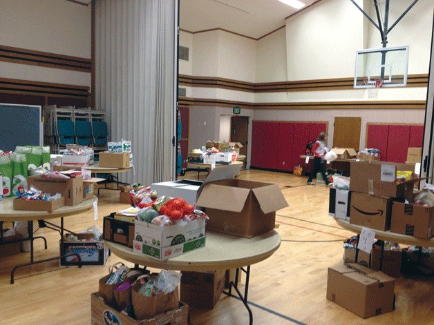 Kirkland Nourishing Network is holding a food drive for local families in need. Cub Scout Pack No. 550 has donated eight boxes of food for the food drive.