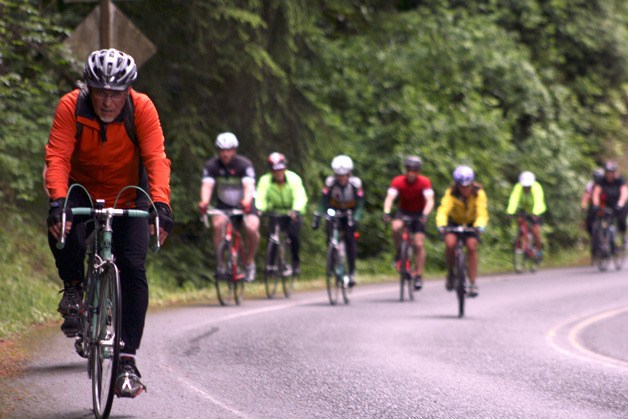 Cyclists power through the last 100 yards of Holmes Point Drive Northeast on Finn Hill during the EvergreenHealth 7 Hills of Kirkland on Monday. The annual fundraiser for Kirkland Interfaiths Transitions in Housing had 939 riders take part this year.