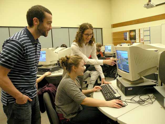 Instructor Corinne Pascale shows student Janai Skiles some information during the new computer science class at Juanita High School.