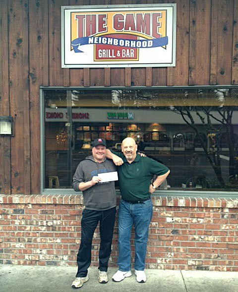 Scott Gongliewski poses with The Game owner Bill Henkens (left). Gongliewski was the winner of the Reporter’s recent Easter contest and won a $100 gift card to The Game Neighborhood Grill & Bar.