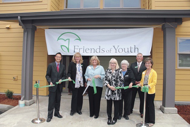 Cutting the ribbon at the official opening of the new Youth Haven home on June 25 are