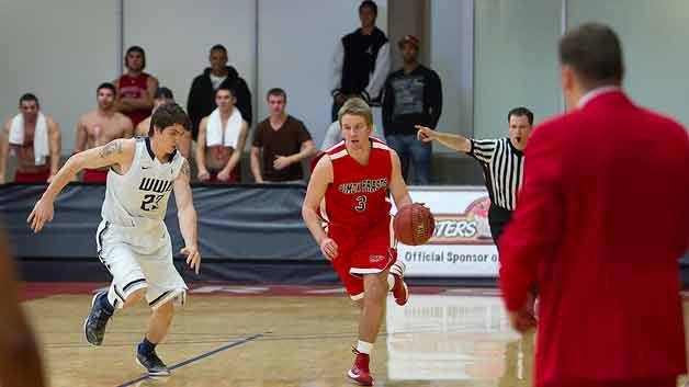 Kirkland native Matt Staudacher (right) is a point guard during his first year at Simon Fraser University.