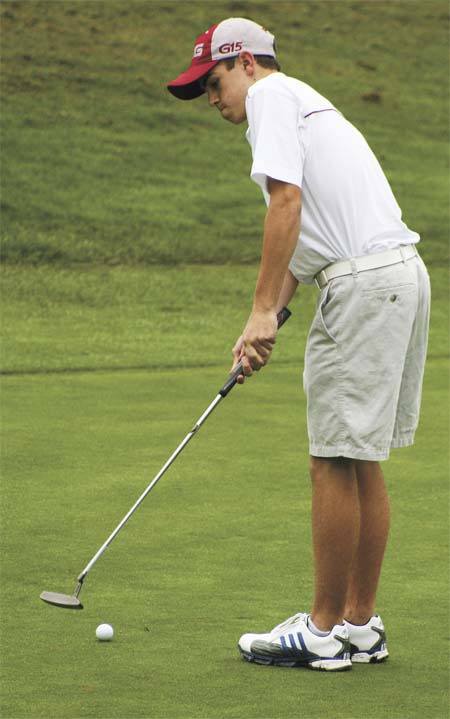 Juanita's Frank Garber practices a putt on the first hole at Wayne Golf Course last Tuesday. The freshman tied for first place during the match against Mercer Island