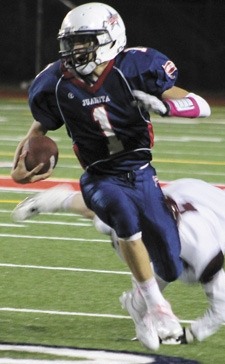 Tavin Montgomery runs away from a defender.