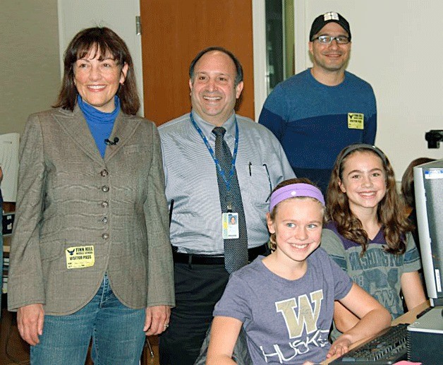 Congresswoman Suzan DelBene FHMS Principal Victor Scarpelli and Code.org CEO Hadi Partovi with FHMS students on Dec. 12.