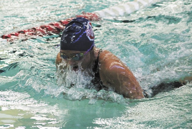 Anna Michel swims during the 200 individual medley race during the SeaKing district meet on Saturday