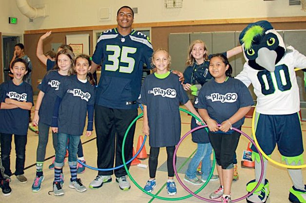 Seahawks cornerback DeShawn Shead and mascot Boom visited Juanita Elementary on Oct. 28 for a Play 60 event.