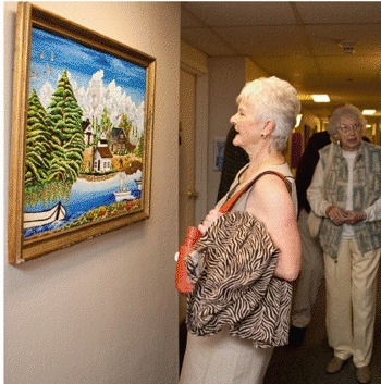 Shirley Ward of the Kirkland Woman’s Club views a painting by Kazuhisa Kashiwaya