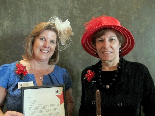 Assistance League of the Eastside president Ginger Clough and Jody Orbits