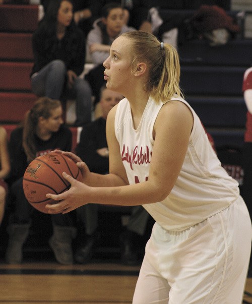 Juanita junior Kate Cryderman prepares to shoot a foul shot during the Rebels game against Mount Si last week. The Lady Rebels lost their first coference game to the Wildcats.