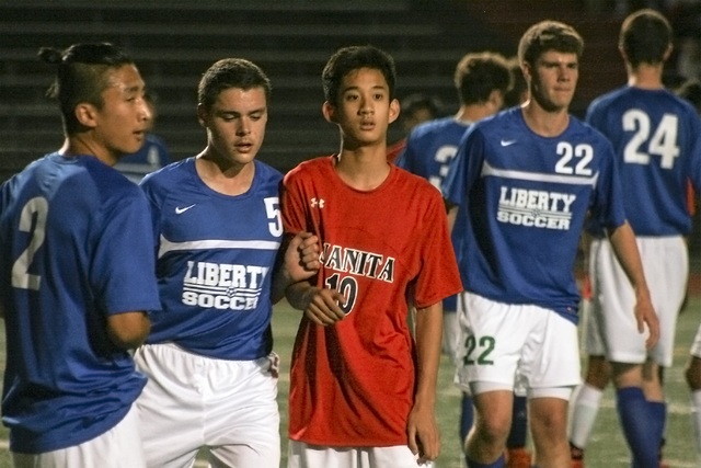 Juanita High sophomore Marc Corpus (10) readies for a corner kick in the second half of Tuesday's KingCo League game against Liberty. The Rebels drew 1-1 on Corpus' 67th minute penalty kick goal. JOHN WILLIAM HOWARD/Kirkland Reporter