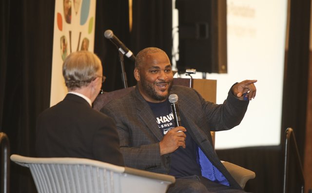 Former Seattle Seahawks offensive tackle Walter Jones talks with John Clayton of ESPN at the Lake Washington Schools Foundation luncheon on Wednesday