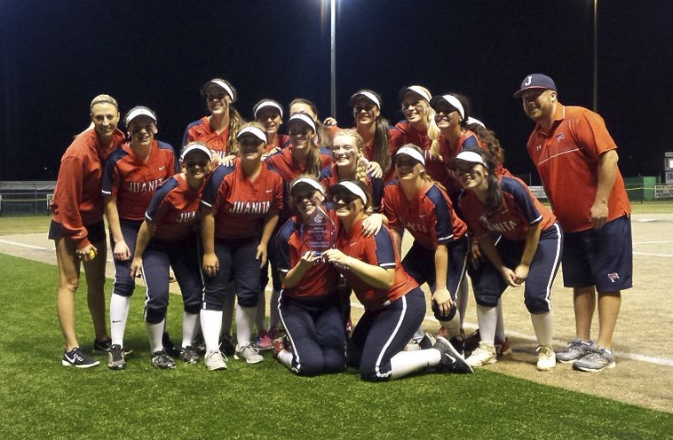 The Juanita High softball team poses with the 3A KingCo trophy following the Rebels’ defeat of Lake Washington on Friday