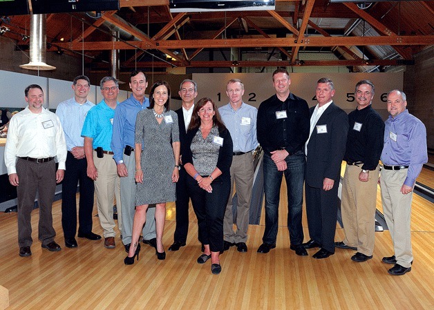 Mortenson leadership group with Big Brothers Big Sisters of Puget Sound CEO Amy Mack and Big Brother Oscar.