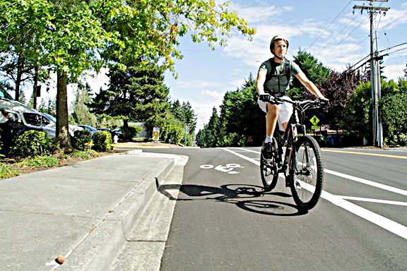 A bike rider uses the bike lanes along Northeast 141st Street shortly after the City of Kirkland created the bike lanes during the 2015 paving process. The City Council is will consider an ordinance on July 19 that will improve safety for bicycle riding by ensuring bike lanes are clear from parked vehicles. Contributed photo/City of Kirkland