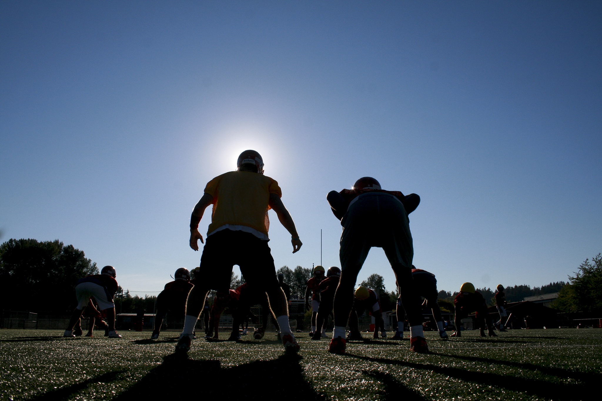 The Juanita High School football team runs offensive drills during practice with a week remaining before the season opener tonight. The Rebels have high expectations this season