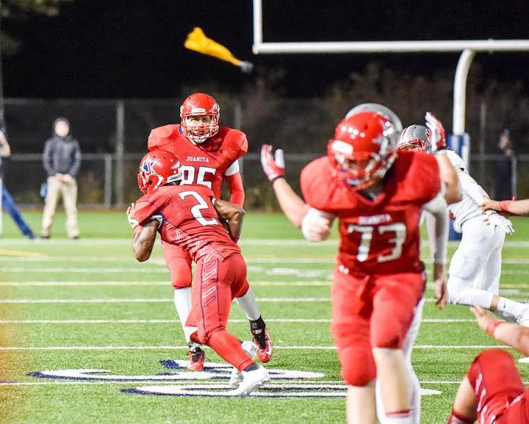 Juanita senior Salvon Ahmed (2) runs past tight end Ravi Regan-Hughes (85) and toward the end zone as a penalty flag flies in the second half of Friday’s 42-22 loss to Mt. Si. The Rebels had two touchdowns called back on penalties. Photo courtesy of Clifford Crawford.