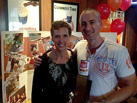 Vicky Hancock from Hancock’s Bakery and Guild Mortgage’s Scott Estes with the 4th annual Hopelink Can Madness trophy. Guild Mortgage of Kirkland ended the Redmond bakery’s three-year domination of the competition to stock Hopelink food banks.